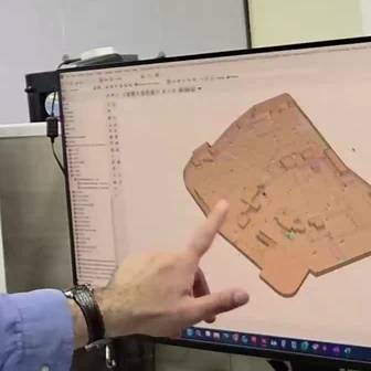 Engineer reviewing project floor plans and design data